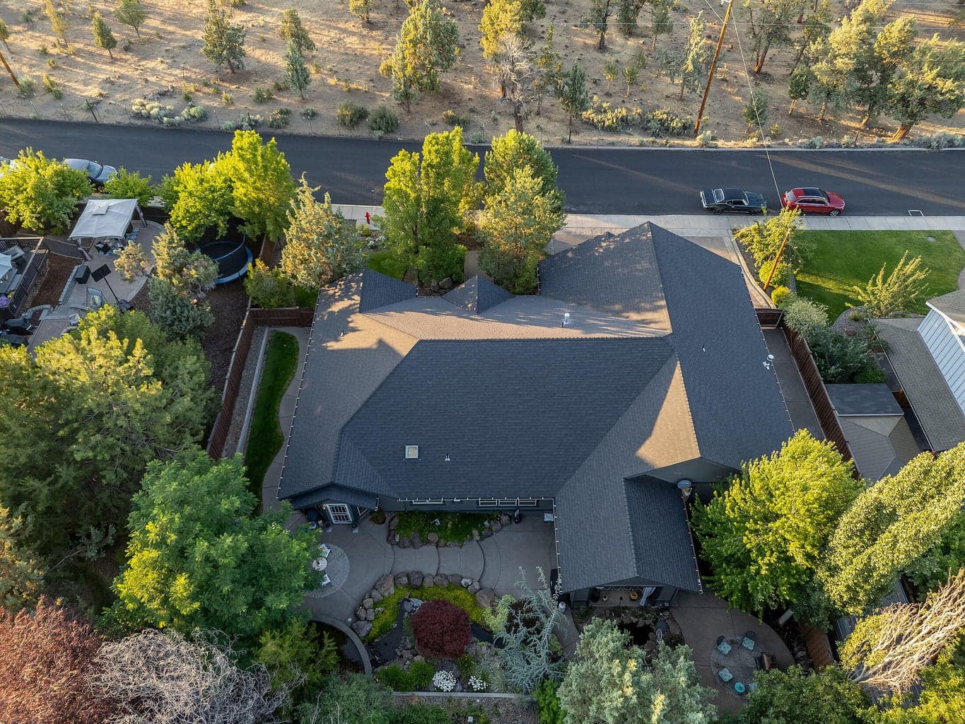 The front of the house sits directly across from vacant privately owned land.