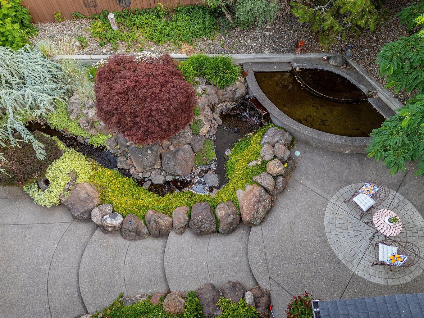 Overview of the pond, stream and one of the sitting areas.