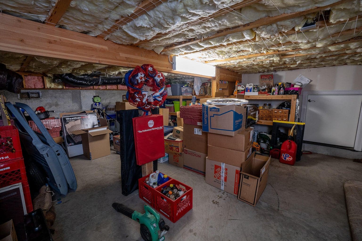 Under house storage is accessible by a door in the garage. Huge amount of storage space or could be made into a wine cellar, man cave?