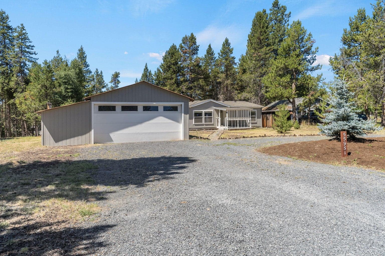 Includes two car garage with extra storage and RV parking space.