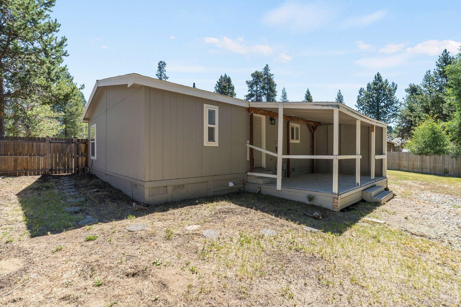 Fenced in portion of back yard.