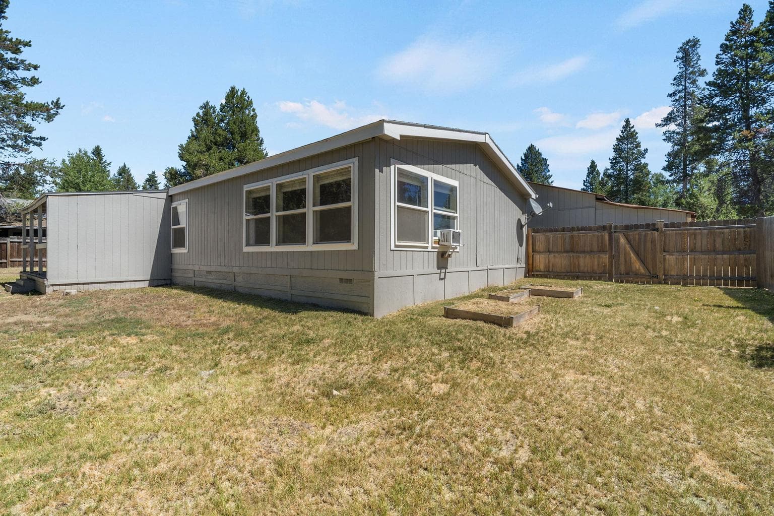 Fenced in portion of back yard.