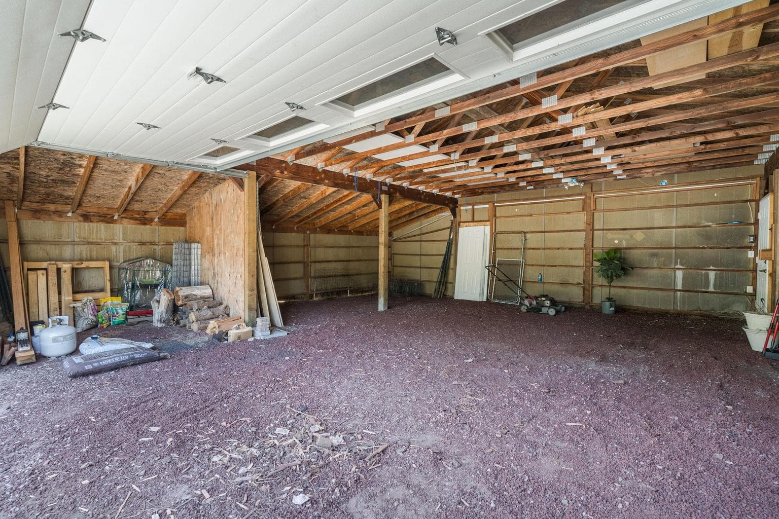 Two car garage with extra storage area.