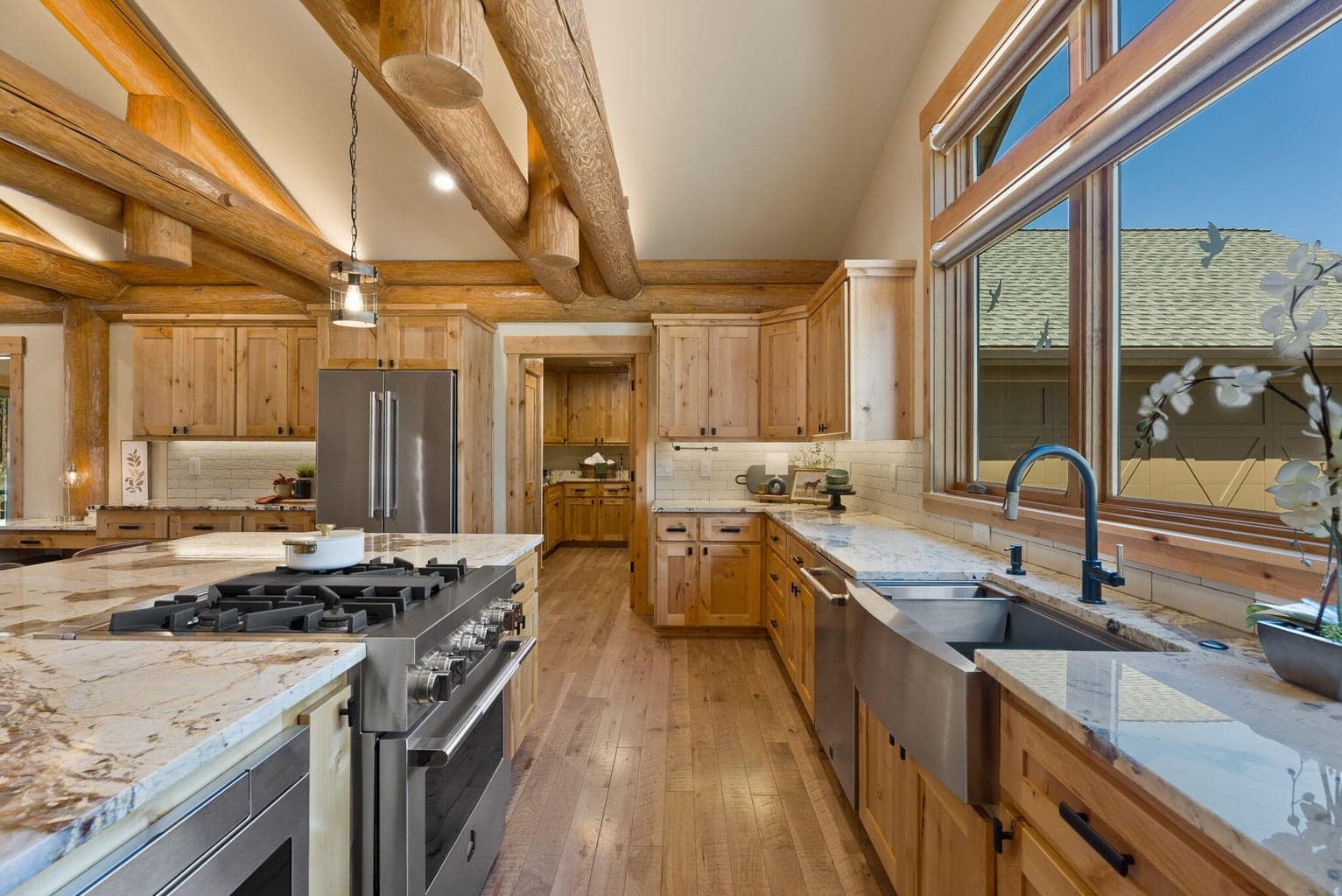 Custom kitchen with granite countertops, high-end appliances, butler pantry, & more!