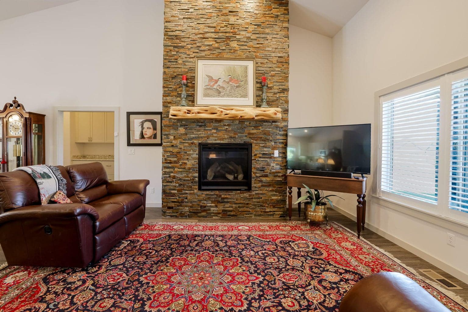 Captivating Floor to Ceiling Rock Gas Fireplace