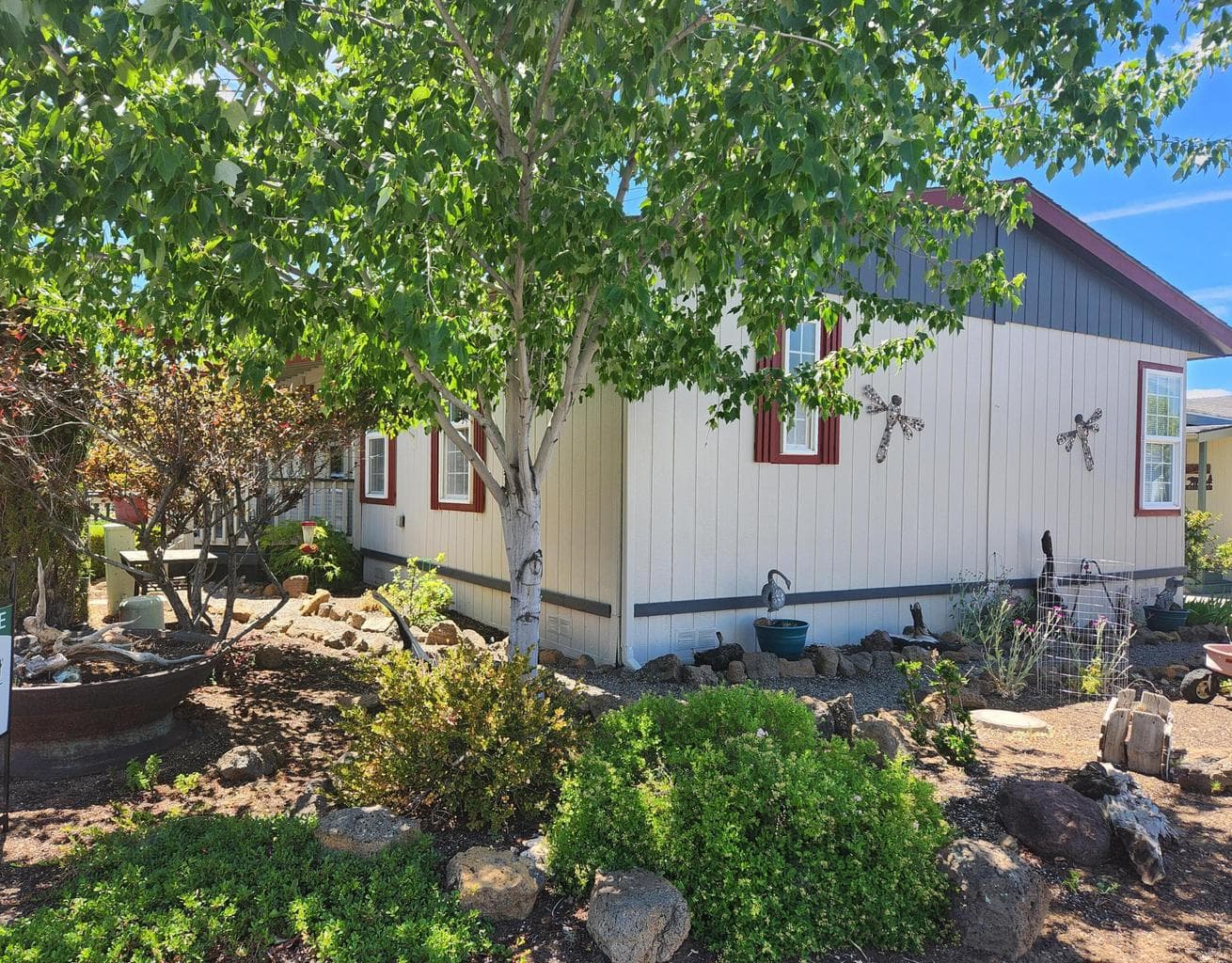 Side of home, beautiful low maintenance yard.