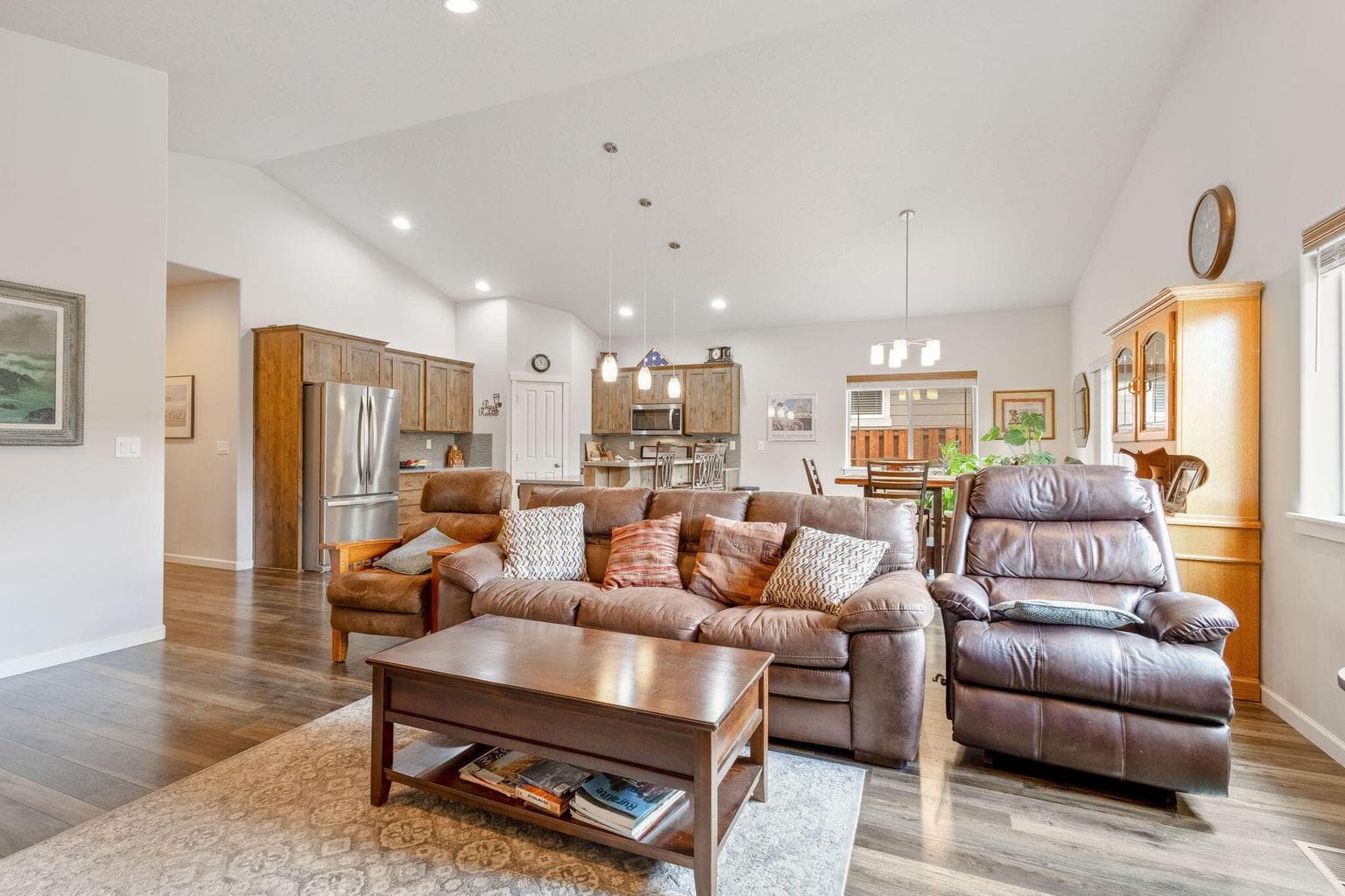Living room with gas fireplace & vaulted ceiling