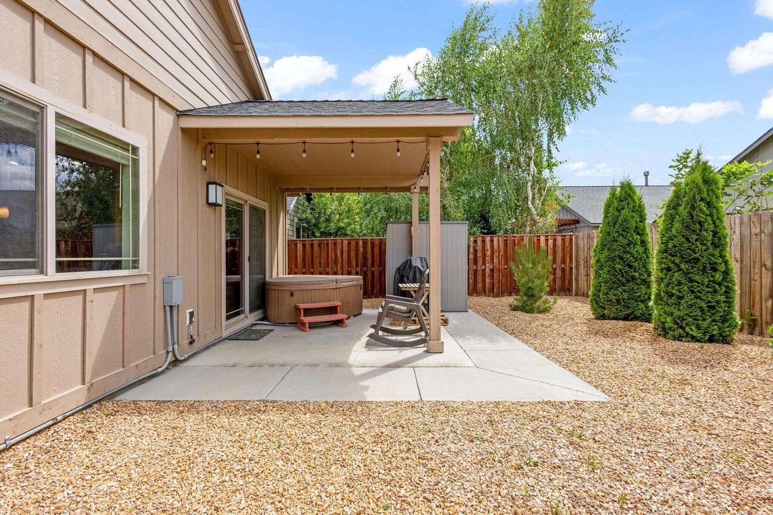 Xeriscaped backyard with covered patio