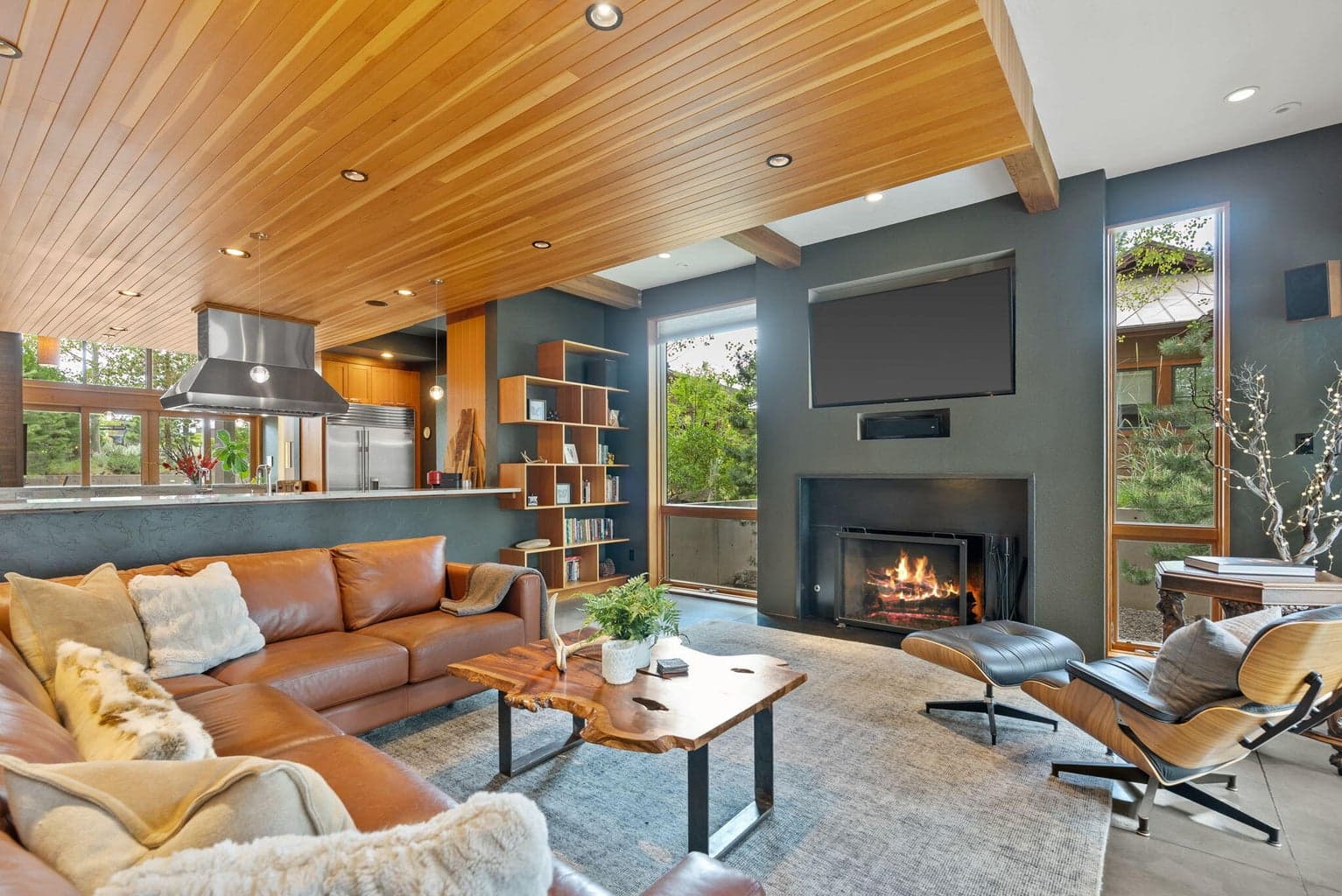 Spacious and simply charming Contemporary NW design with a wall of doors opening to the back patio, blending indoor/outdoor living seamlessly.