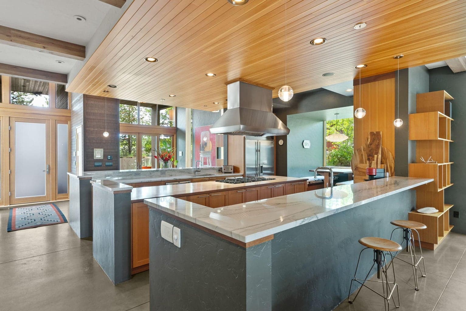 Outstanding Chef's Kitchen with sleek quartzite countertops, maple slab island and top-of-the-line professional grade appliances throughout.