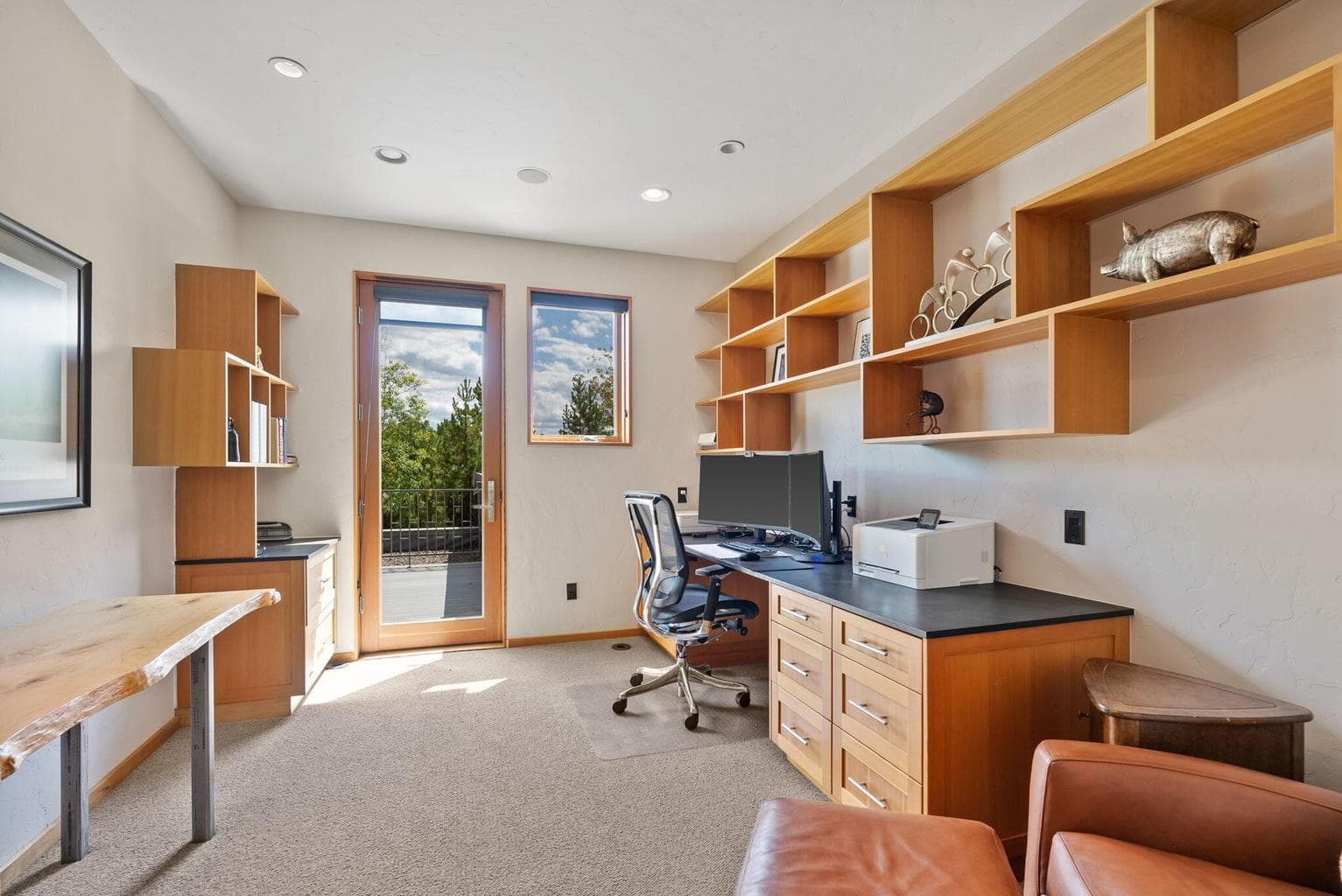 Custom built-ins and access out to rooftop deck.