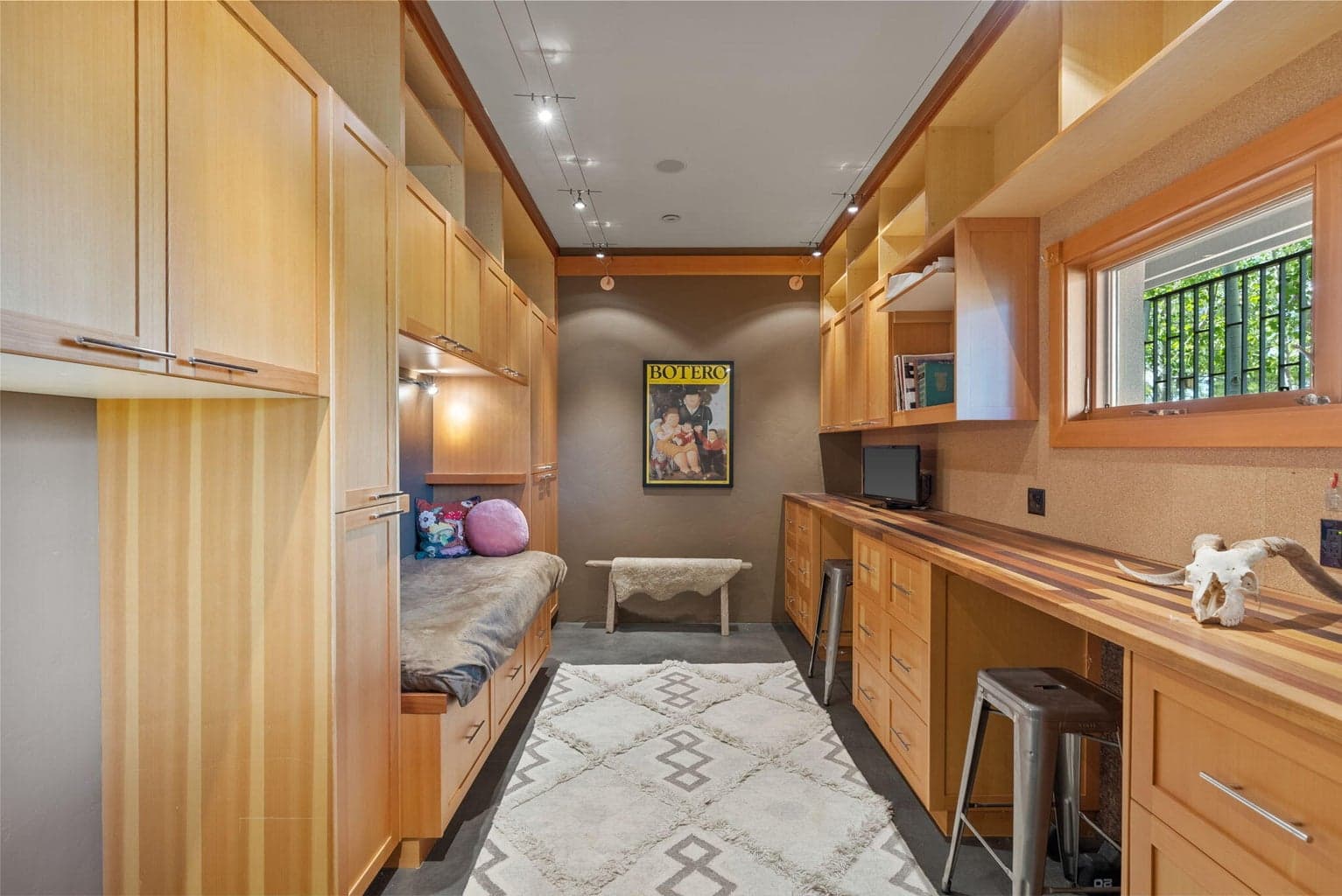 Located off garage with plenty of built-ins and space to create.