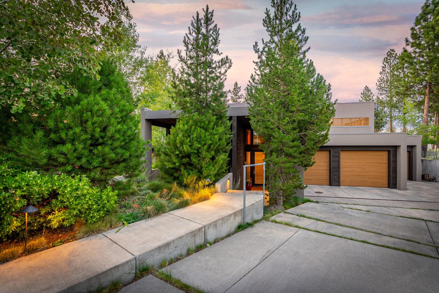 Graciously set back from the street with mature foliage for privacy.