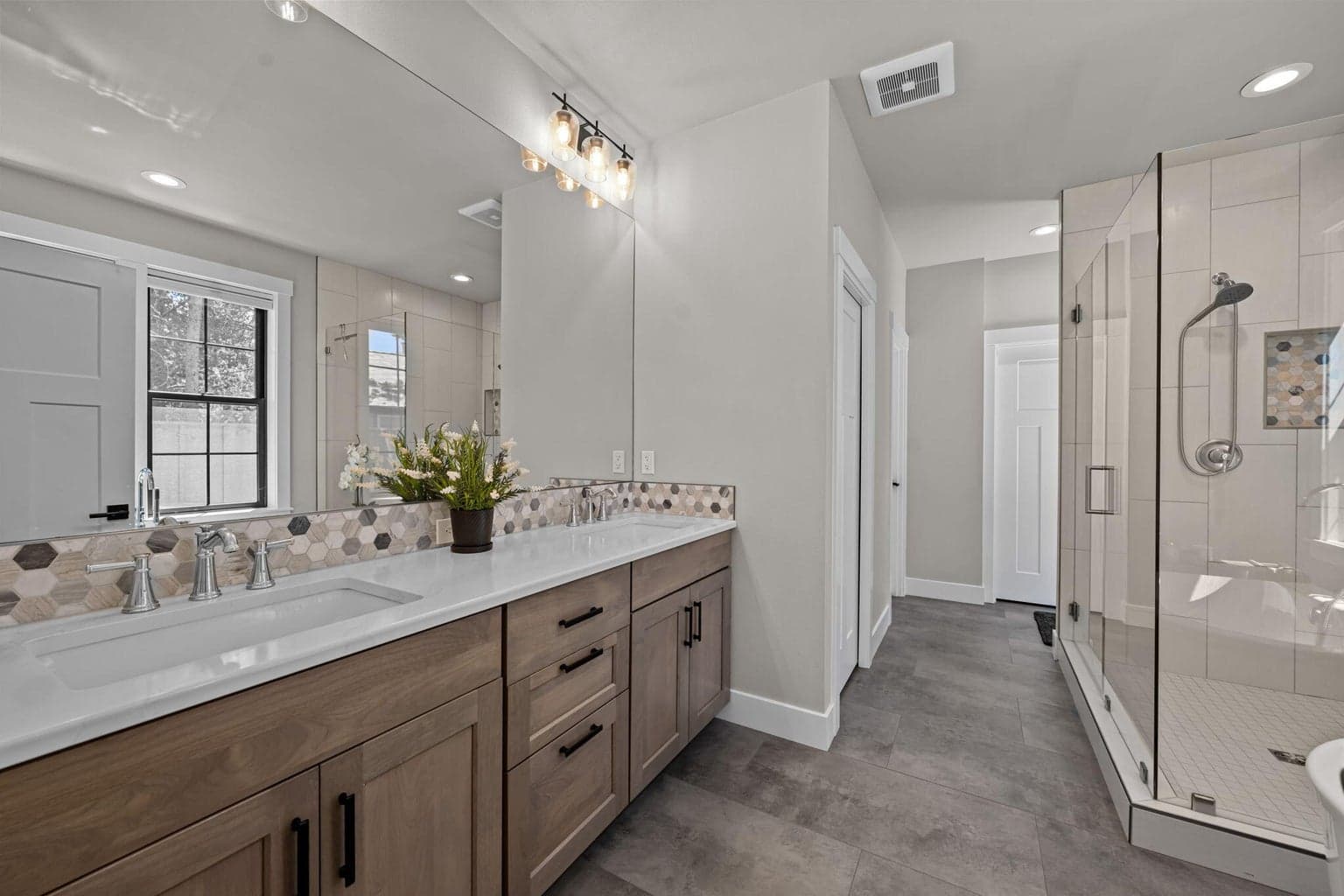 Primary bathroom with double undermount sinks and quartz counters