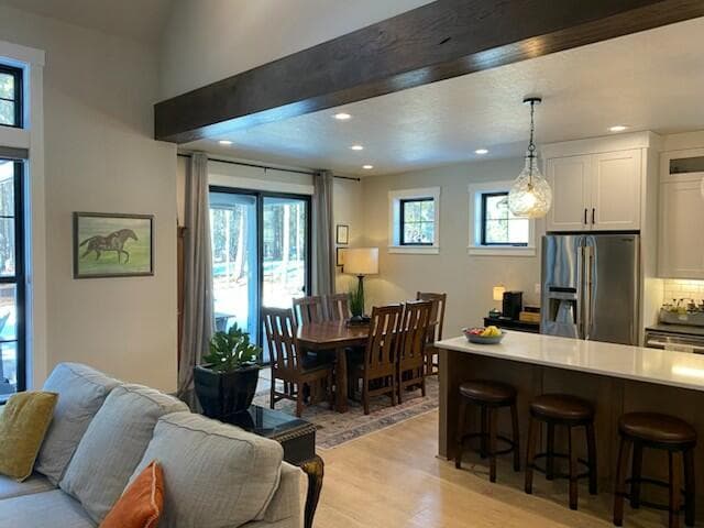 Dining room off the kitchen with sliders to covered deck