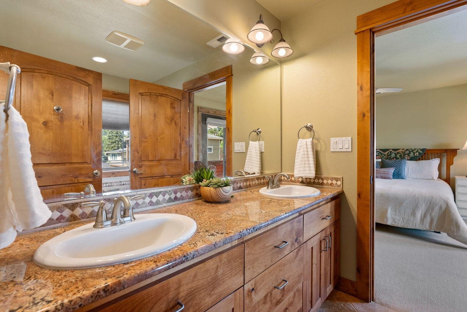 Primary bedroom, double vanity, inclosed toliet & shower; soaking tub.