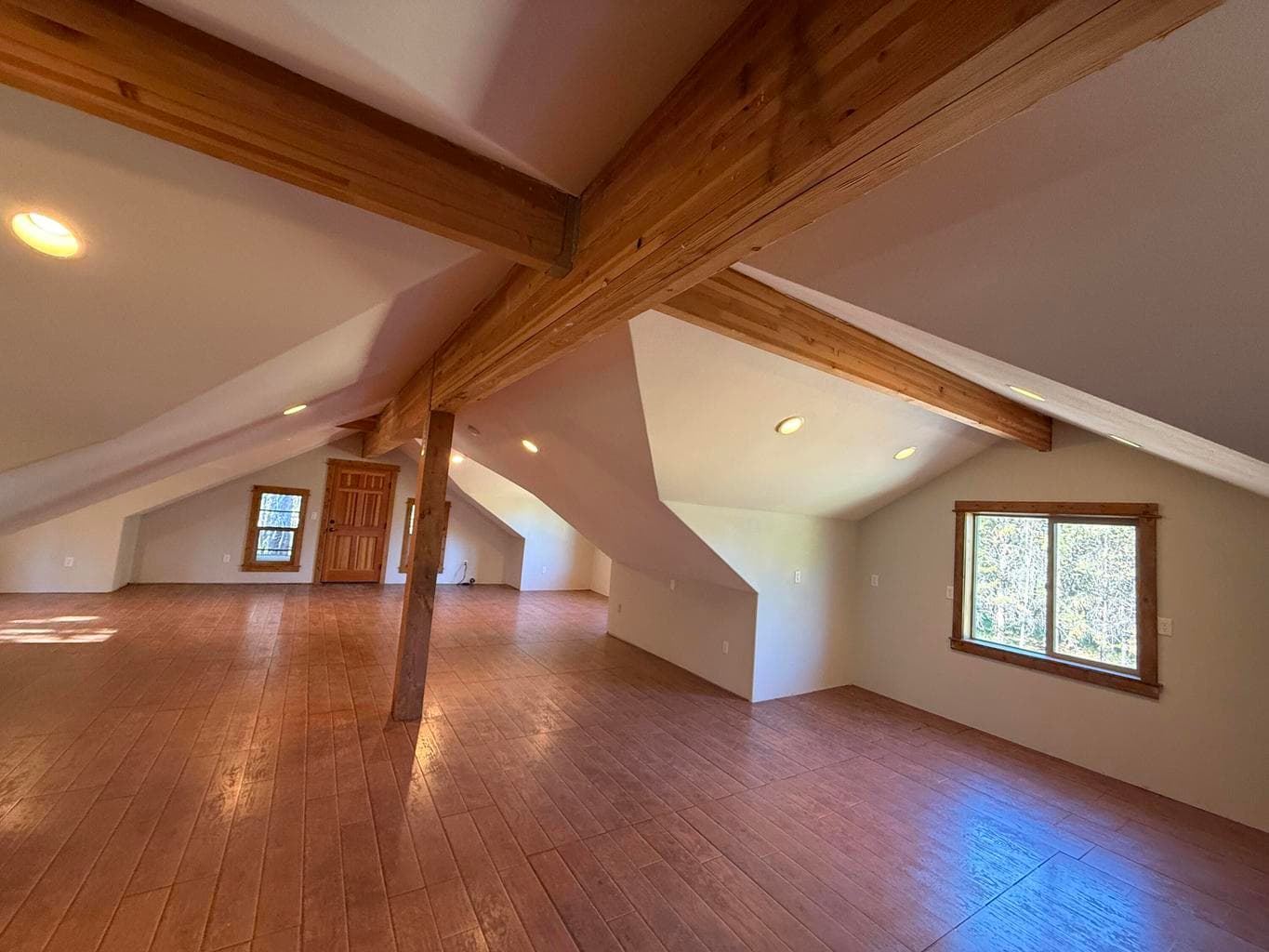 Large finished space above the garage is great for your creative twist!