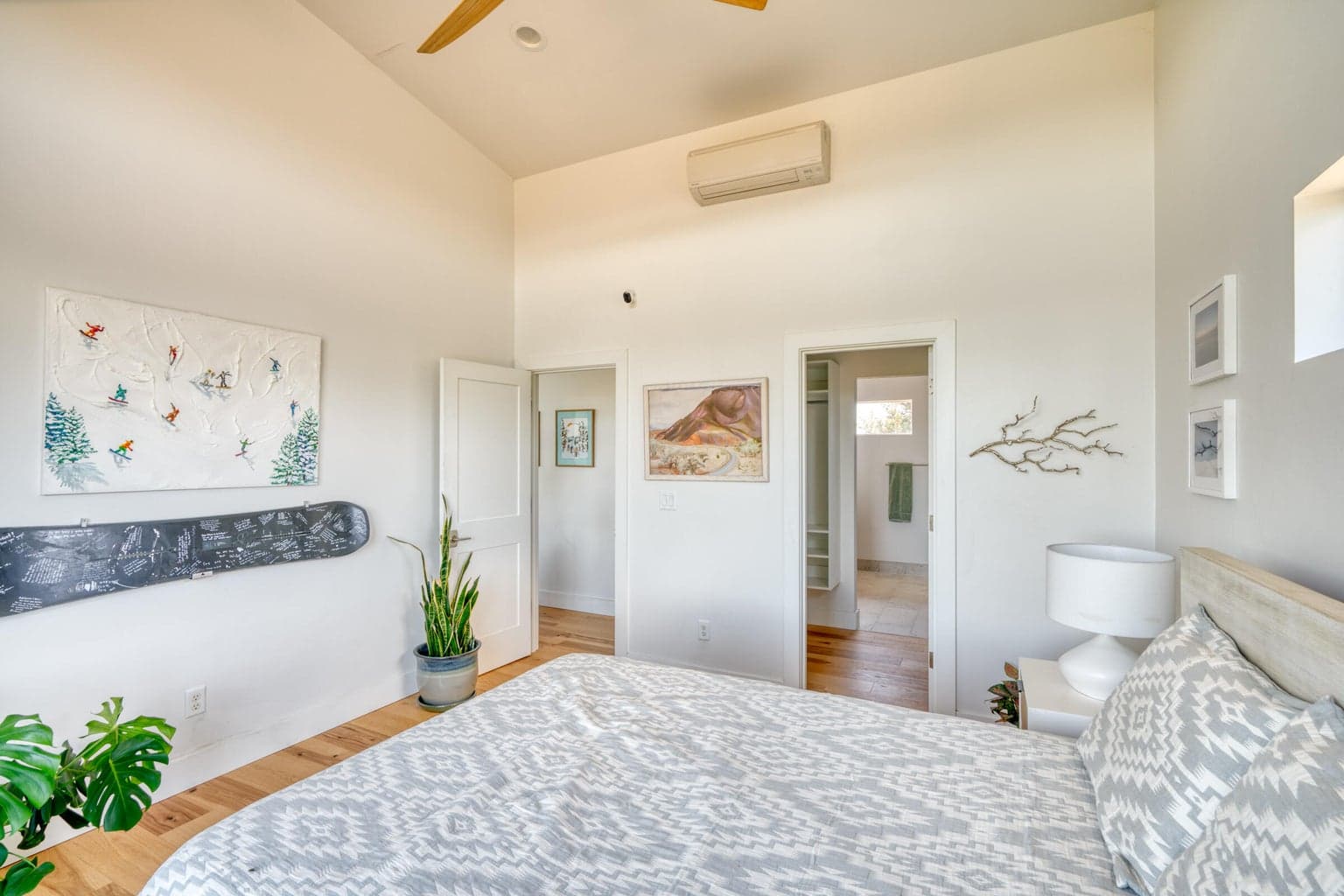Primary bedroom with vault ceilings