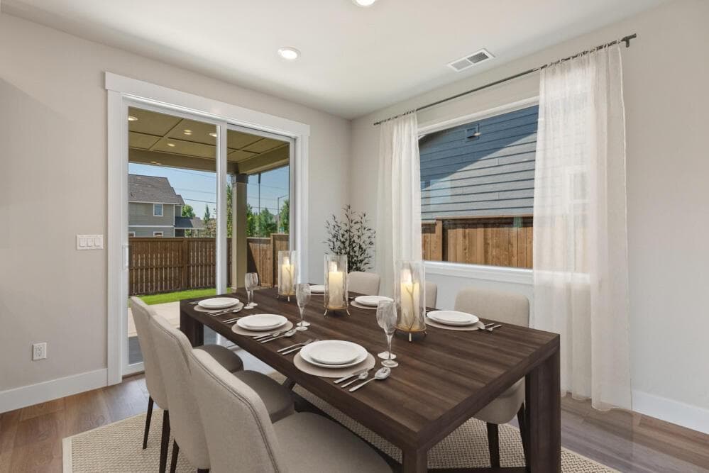 Dining room. Photos have been virtually staged.