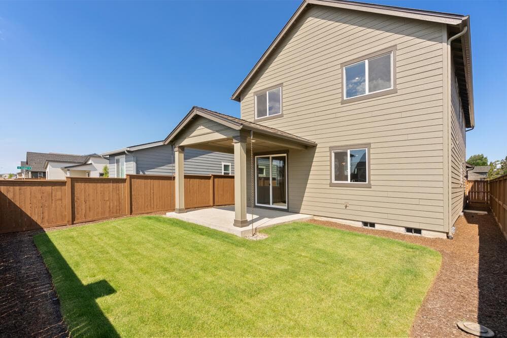 Fenced and landscaped back yard.