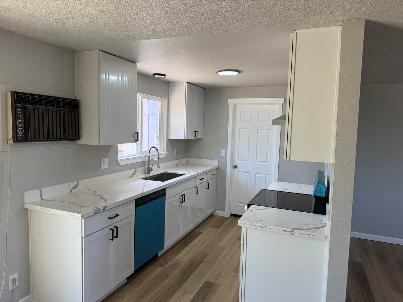 New cabinets, quartz counter tops, appliances, sink