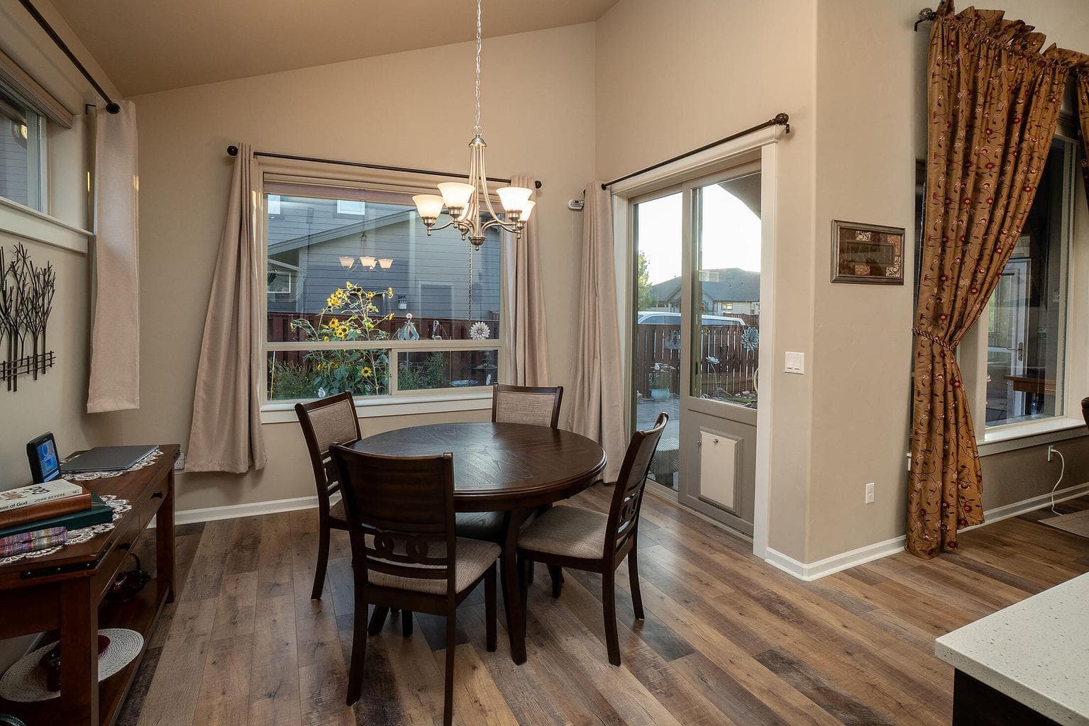 Dining area overlooks the patio and planting area.