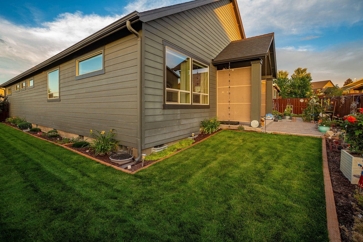 Covered rear patio with privacy/wind screen