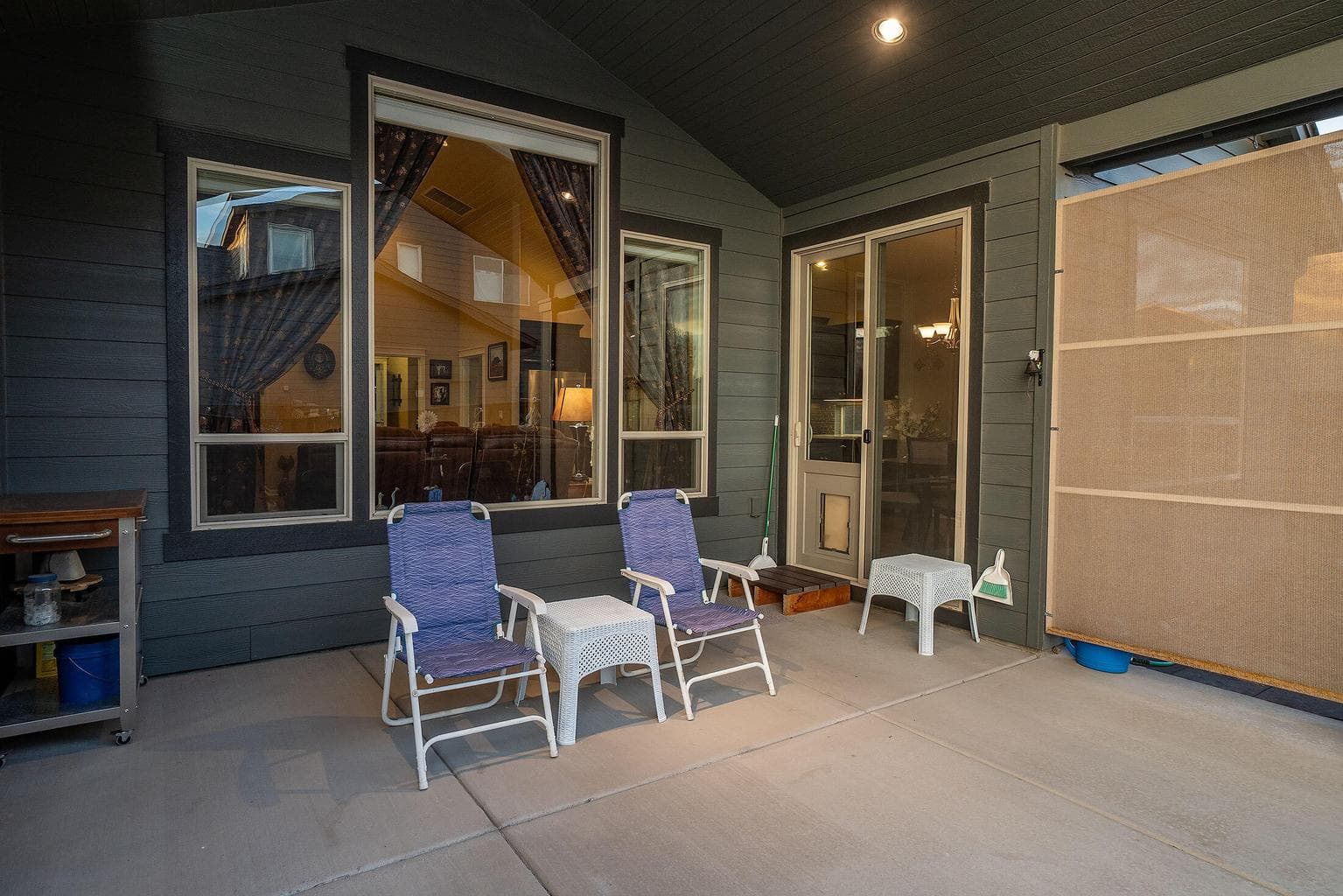 Covered rear patio with privacy/wind screen