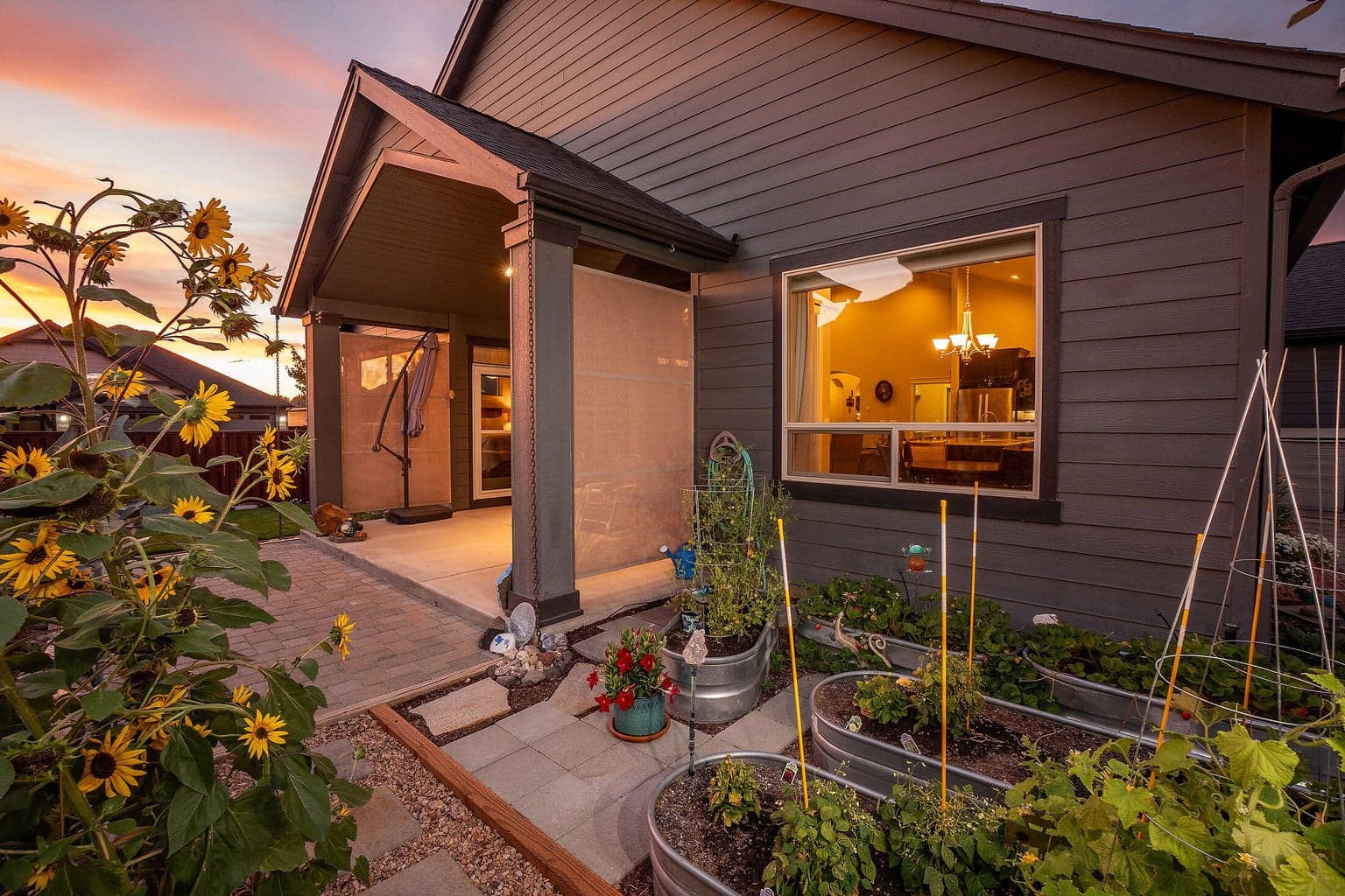 Covered rear patio with paver block extension.