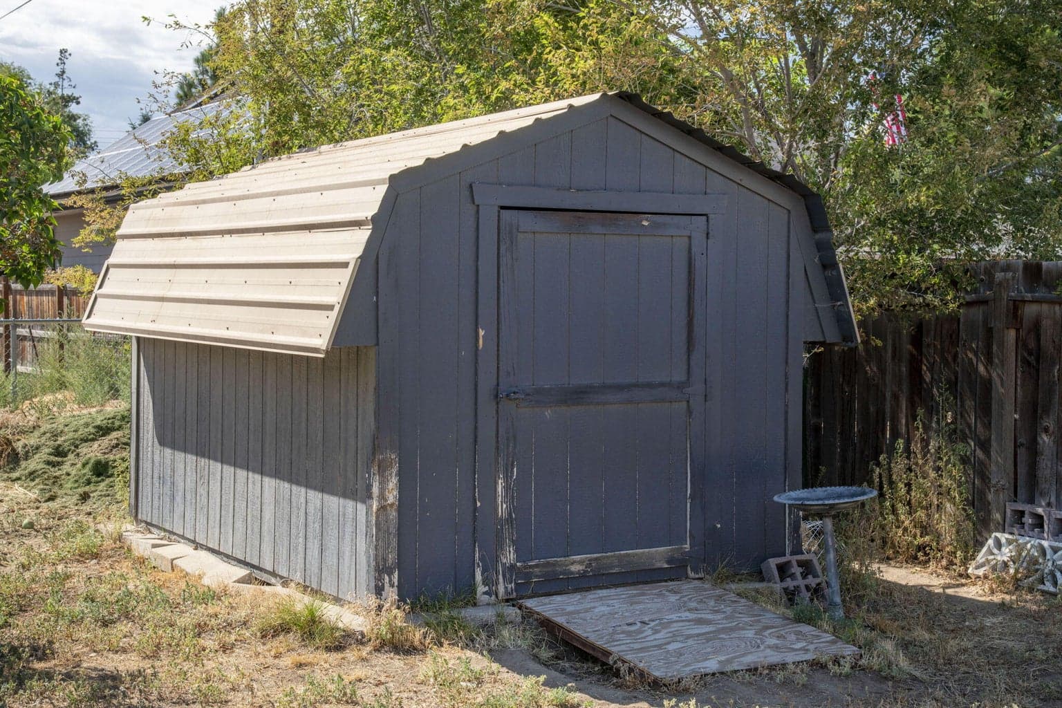 Garden shed located towards the outer edge of the backyard