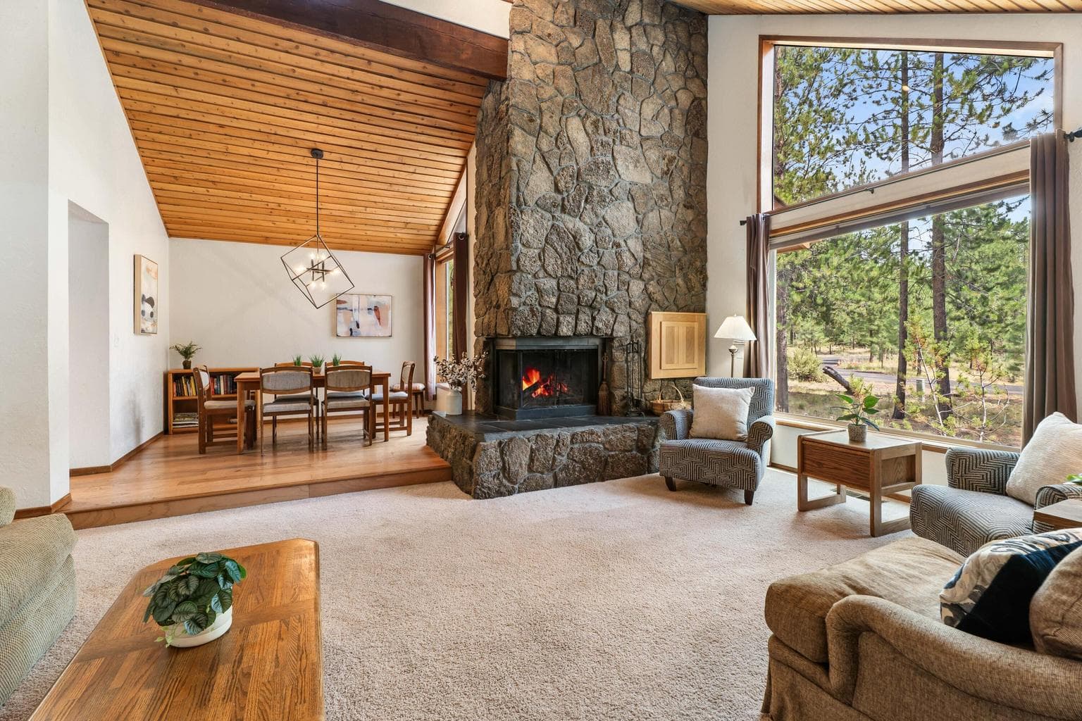 Living Room with floor to ceiling lava rock wood burning fireplace