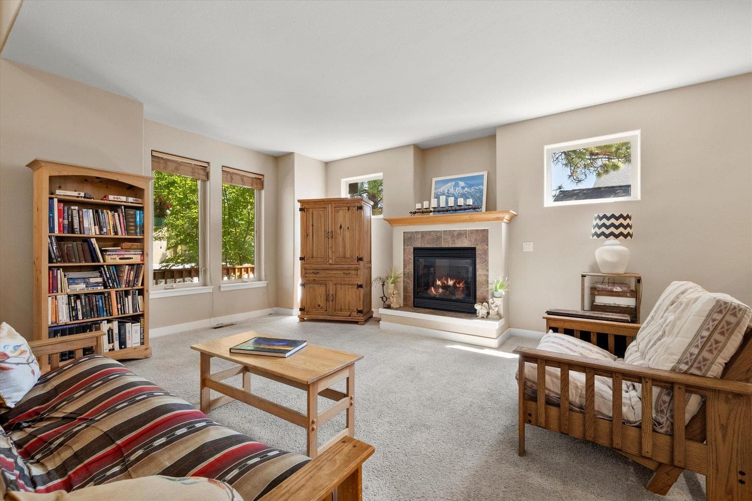 Gas Fireplace in Great Room. Windows let in natural light.