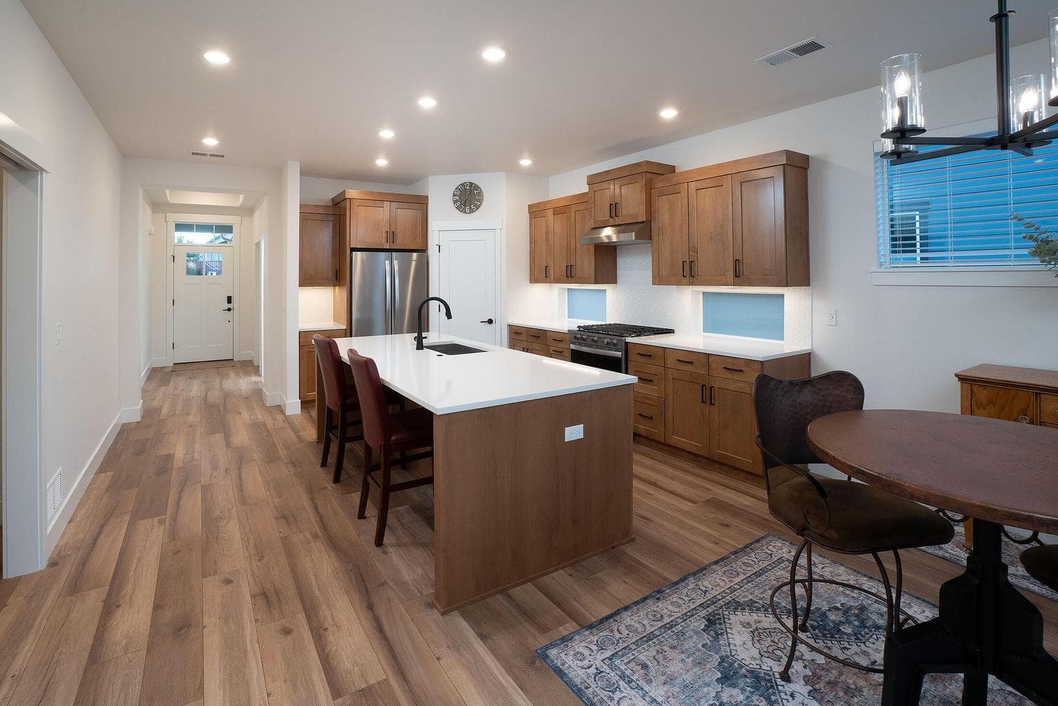 Kitchen with corner pantry and upgraded under cabinet lights.
