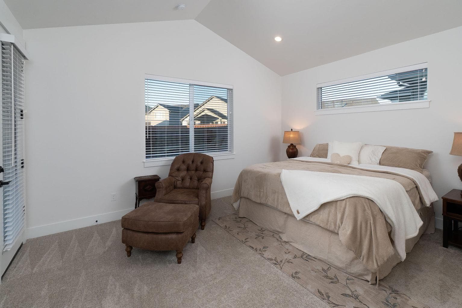 Primary suite with vaults and door to covered rear patio