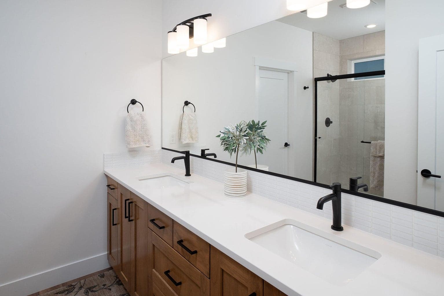 Primary suite bath is spacious having a tile shower, water closet and walk in closet.