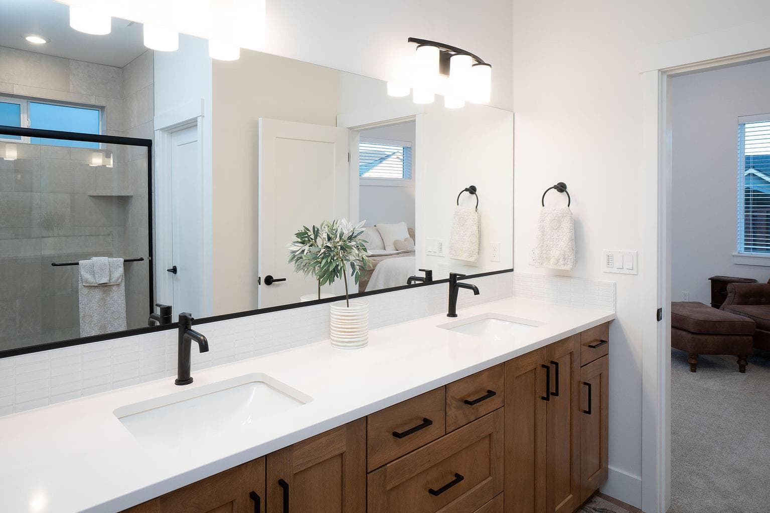 Primary suite bath is spacious having a tile shower, water closet and walk in closet.