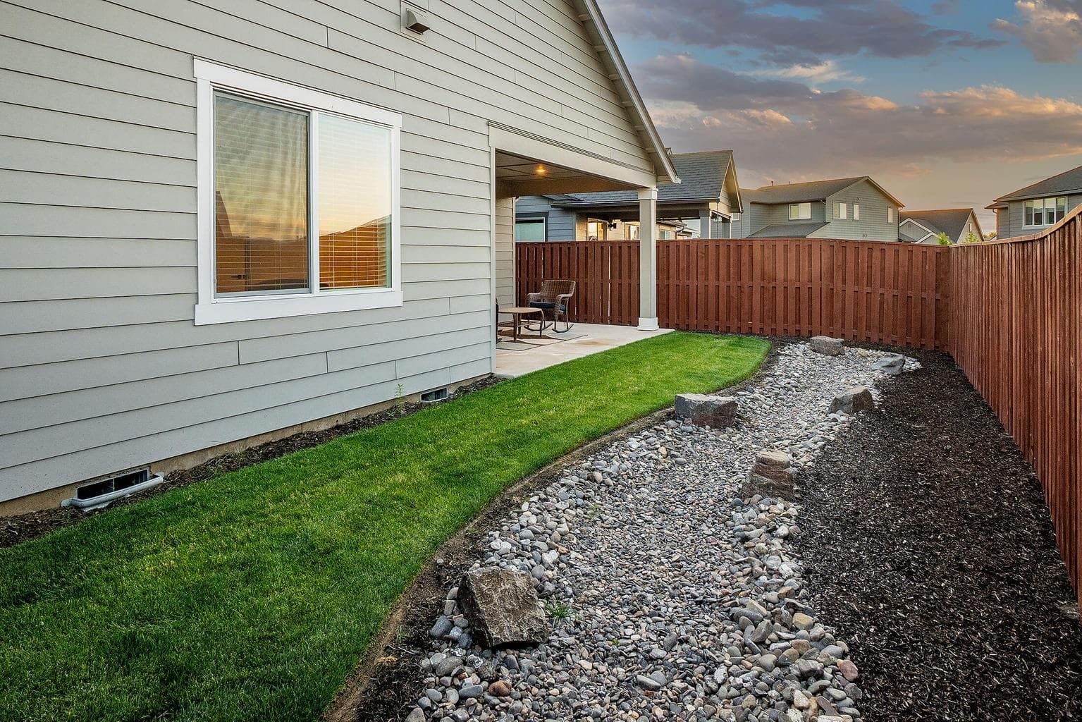 Rear yard is landscaped with sprinkler system