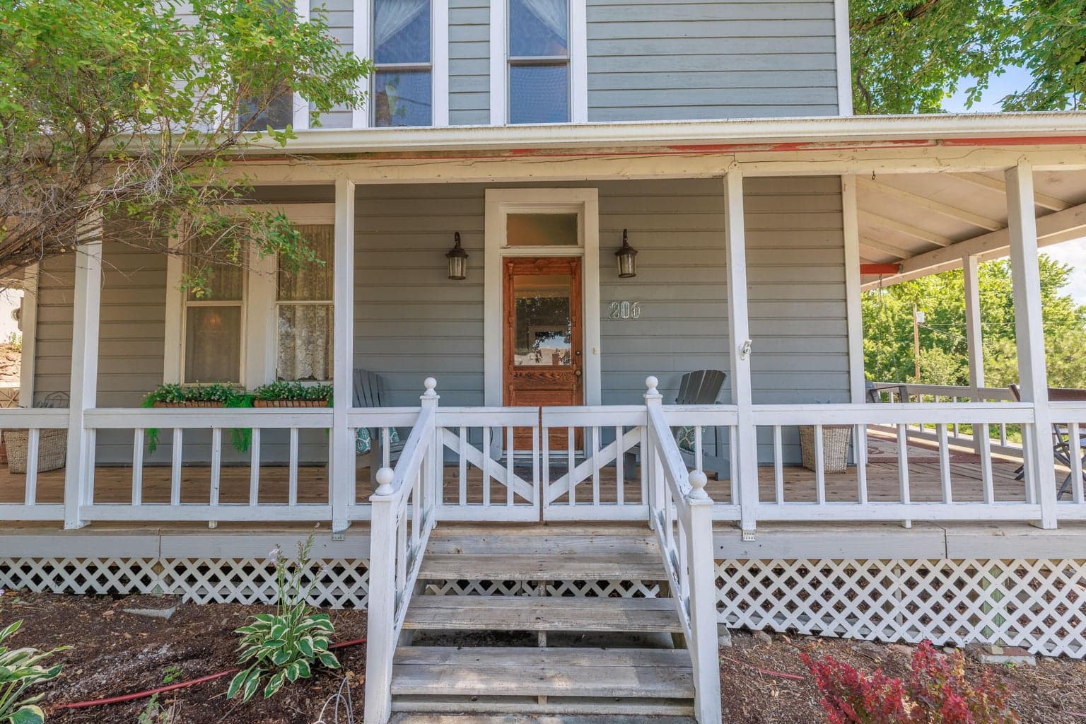 Porch wraps around to the back door