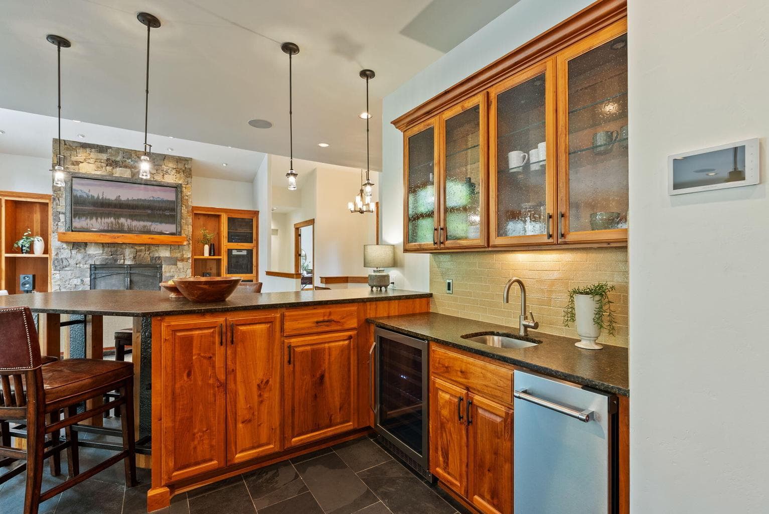 Wet bar with ice maker and wine fridge