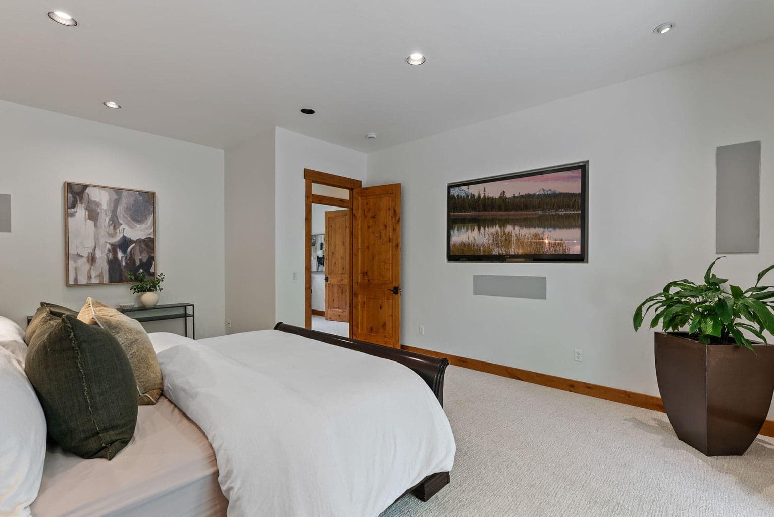 Main level Primary suite with built in speakers and TV