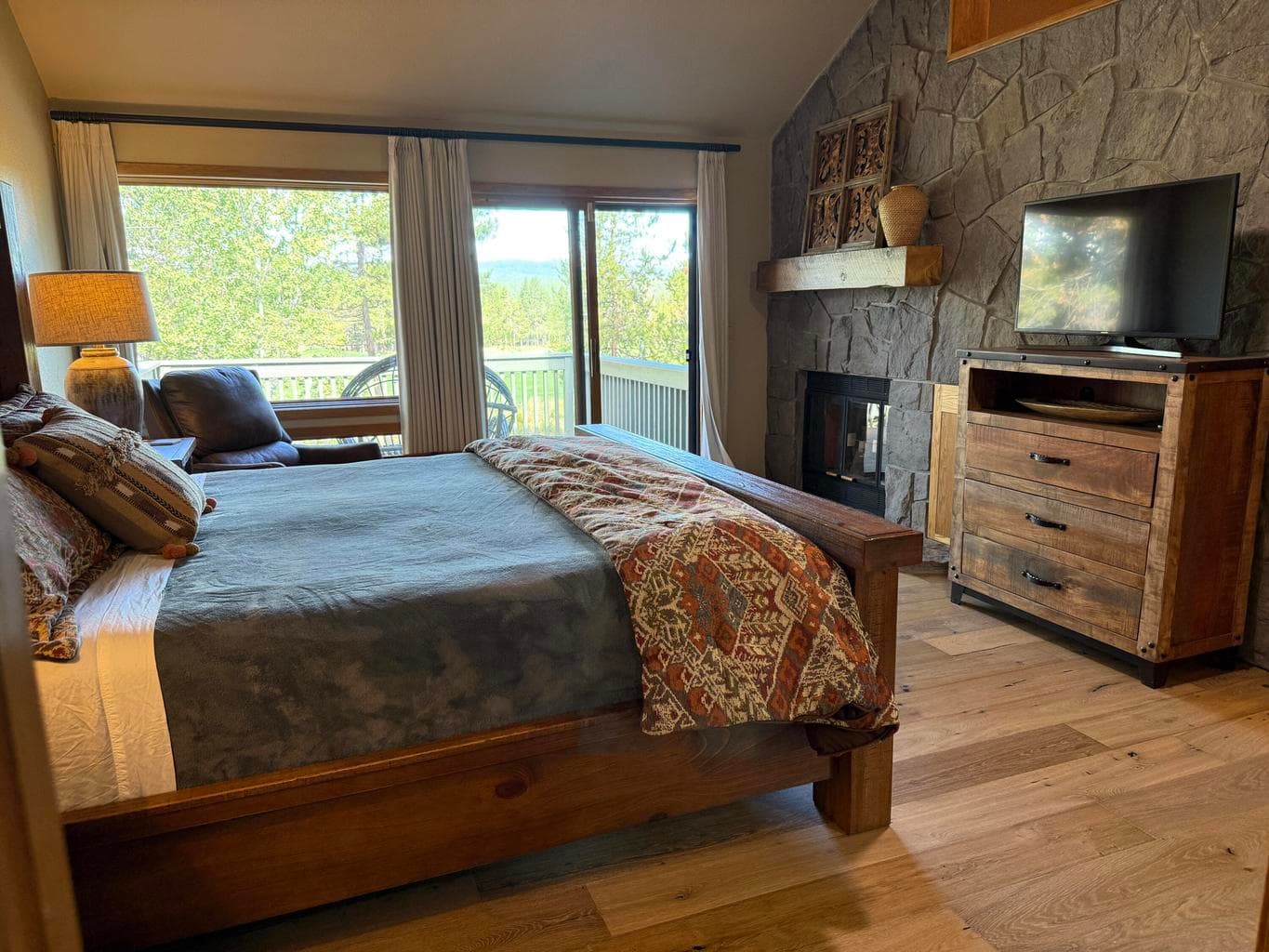 Primary suite includes walk-in closet, wood burning fireplace and outdoor deck overlooking the golf course and mountain.