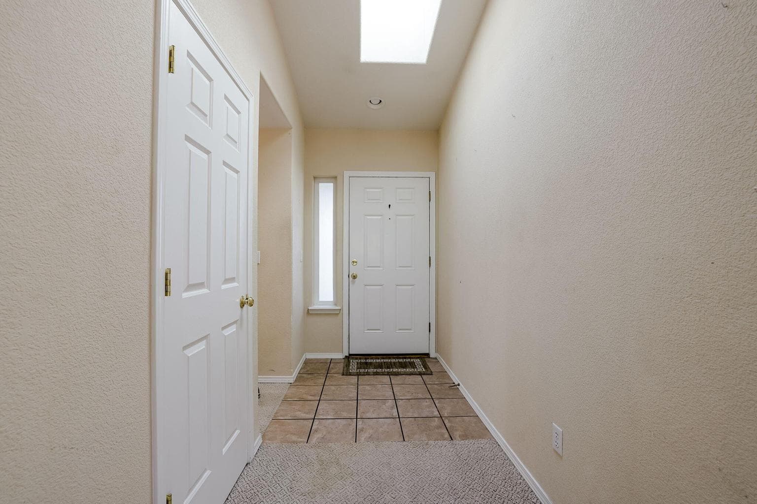 Front tile entry, coat closet