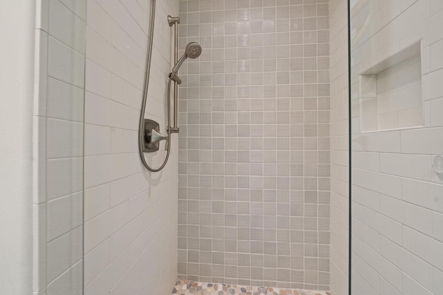 Tile shower in the guest bath updated in 2021