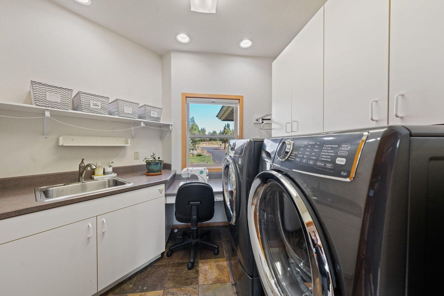 Spacious laundry room with sink