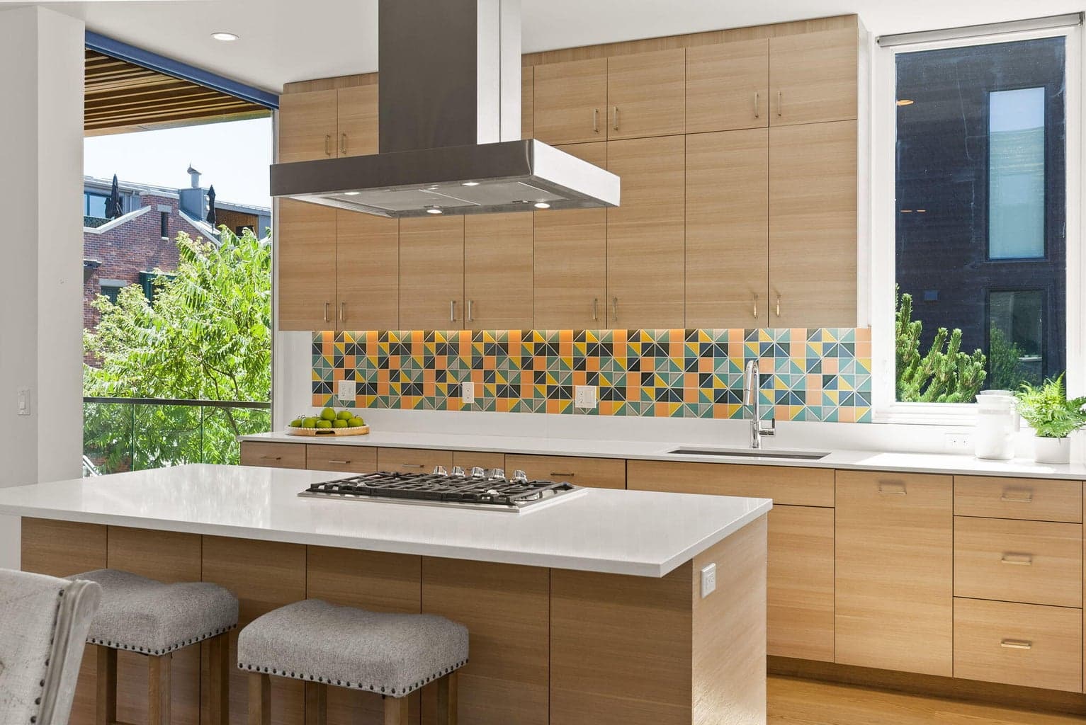 A wonderful space to entertain with additional informal seating and ample cabinetry.