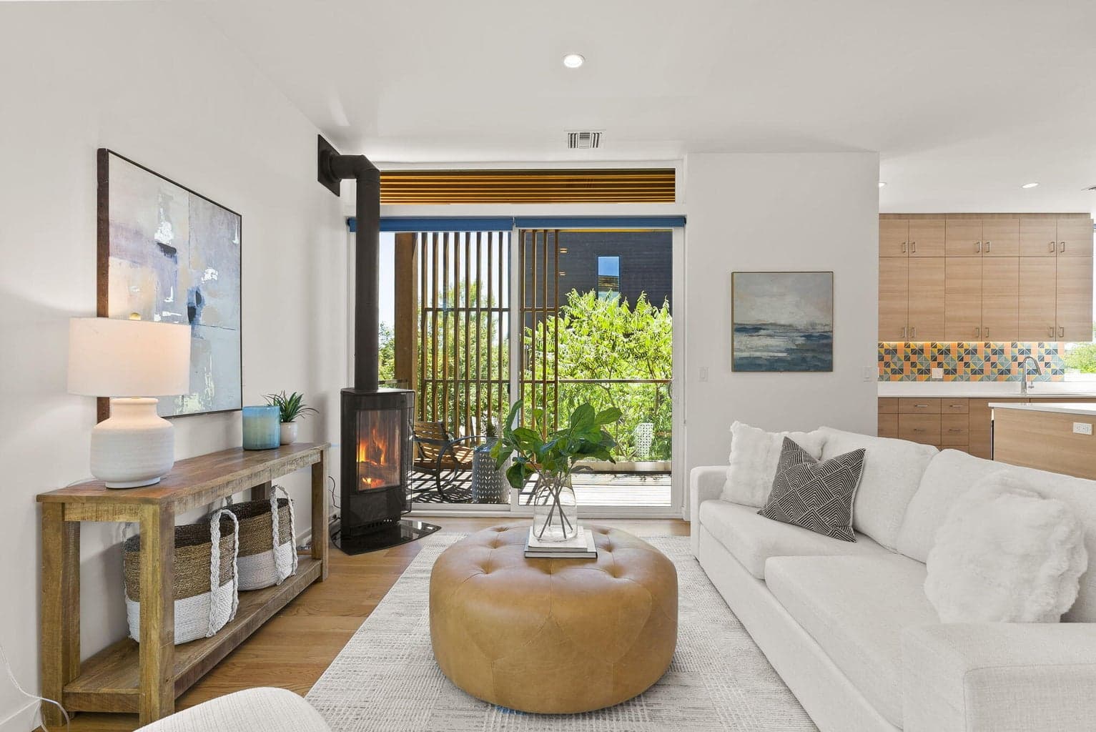Cozy gas fireplace and access out to a delightful covered deck.