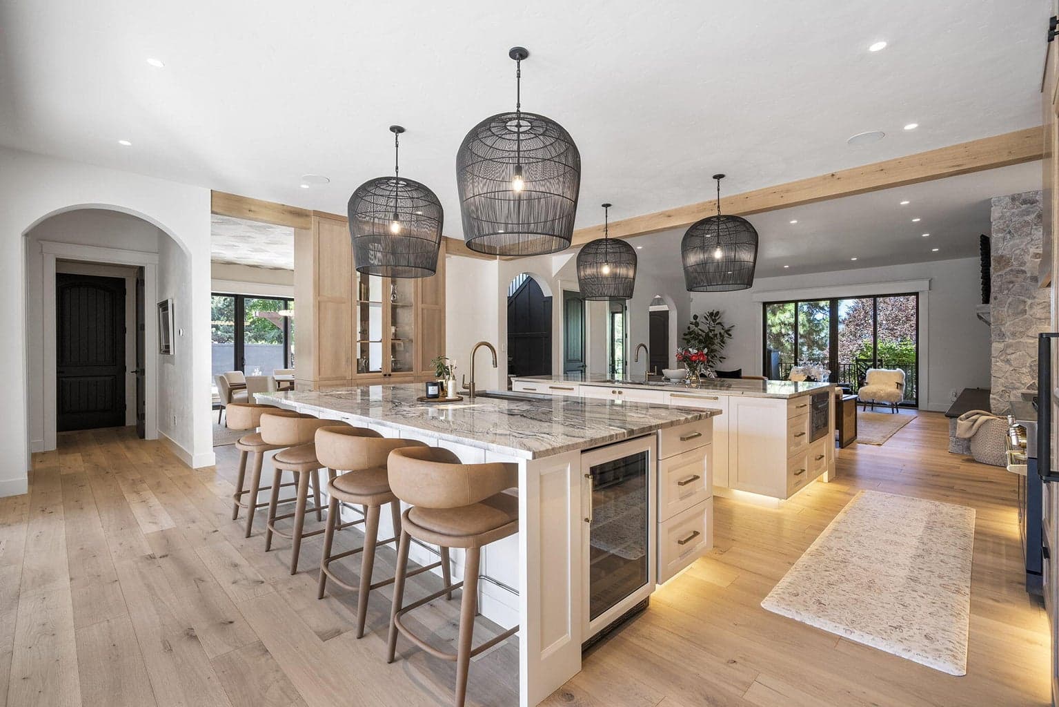 Island ends feature a beverage fridge and drawer style microwave