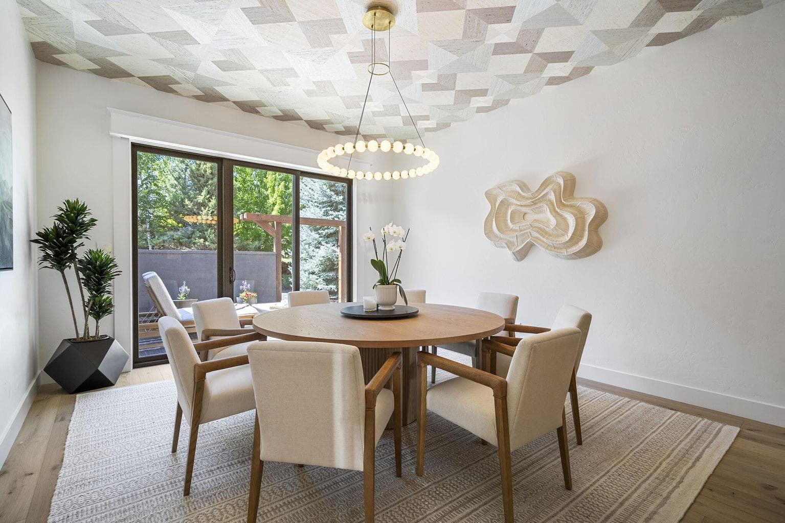 Phillip Jeffries grasscloth crowns the formal dining room