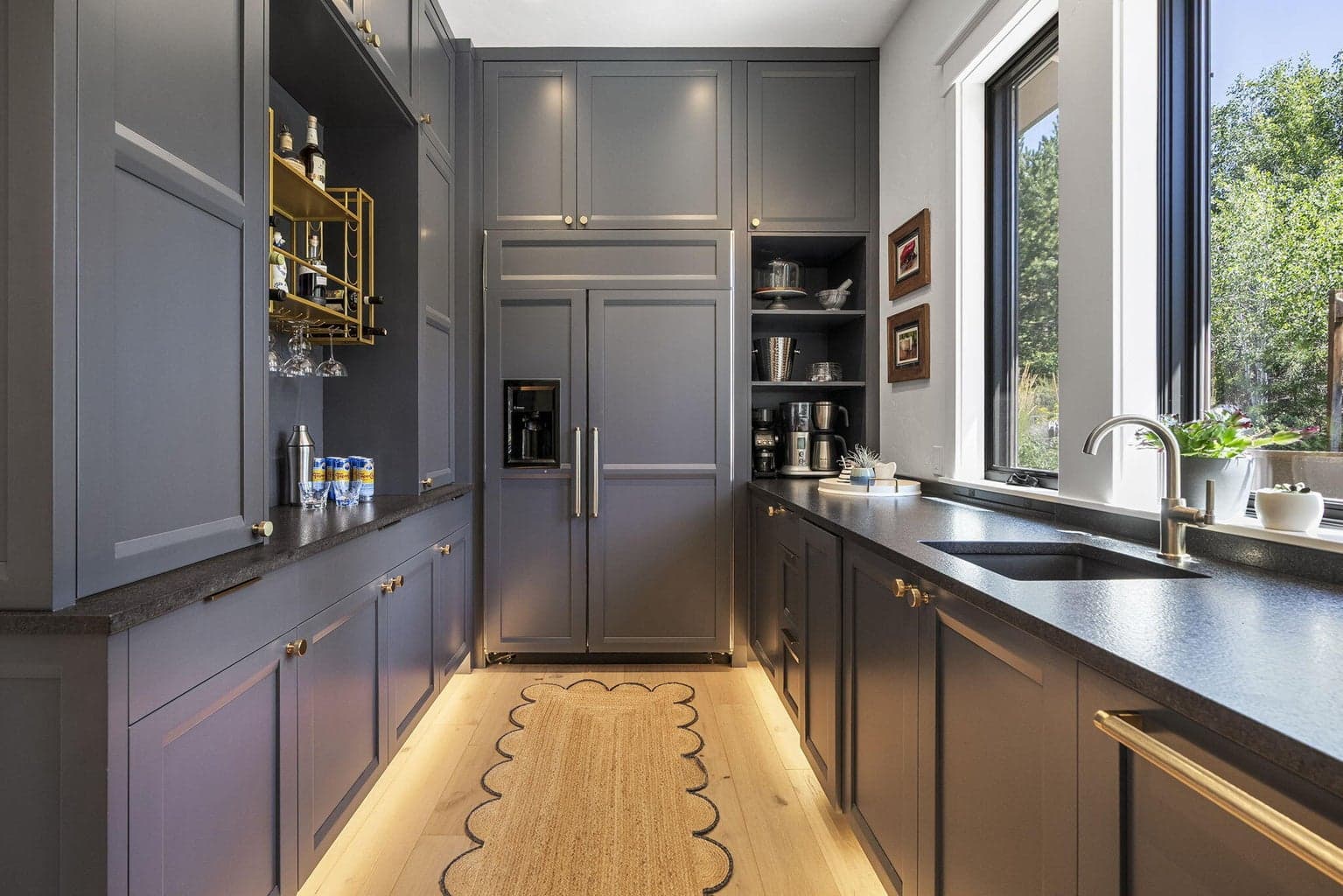Scullery goals! Featuring a built in fridge, bar area, ice maker, and sink.