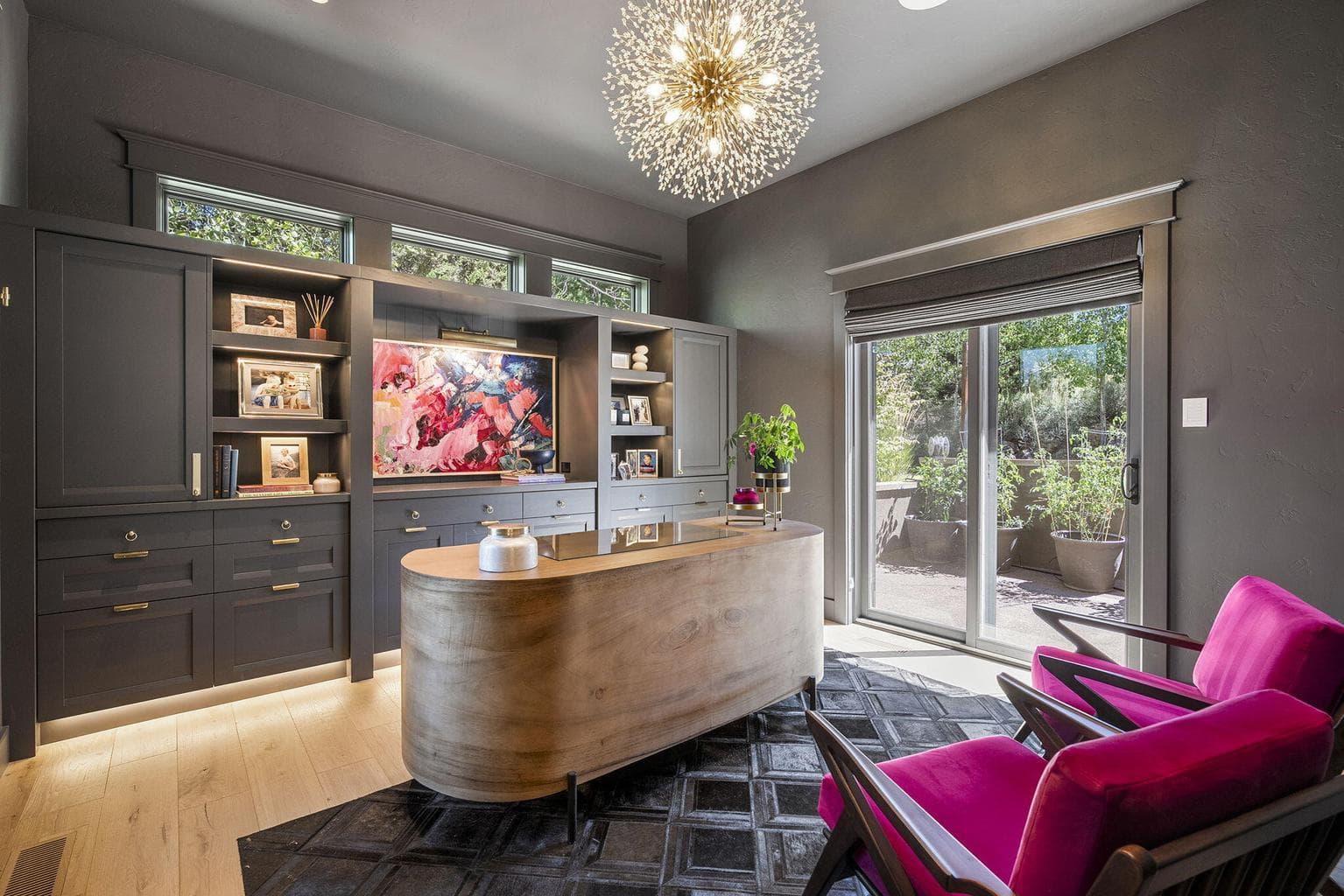 Color drenched home office with custom made built in shelves and cabinets